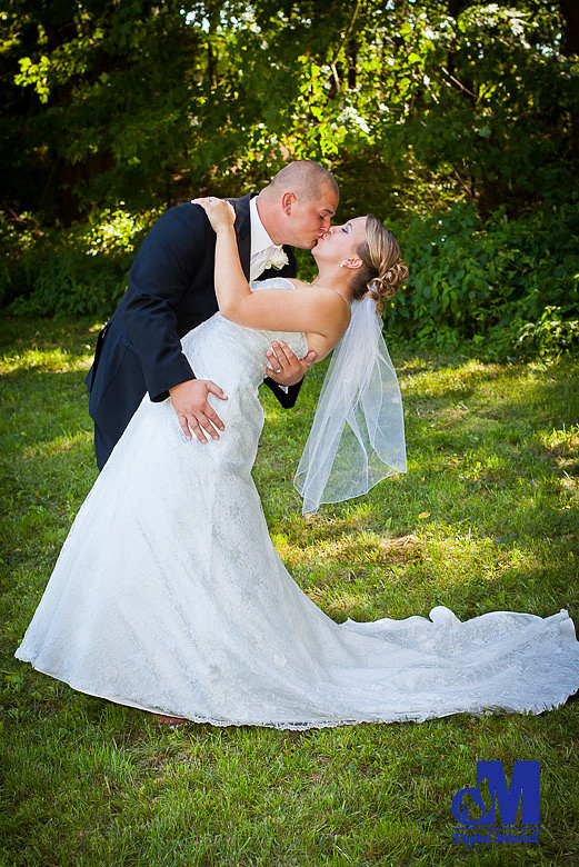 Photograph of bride and groom kissing