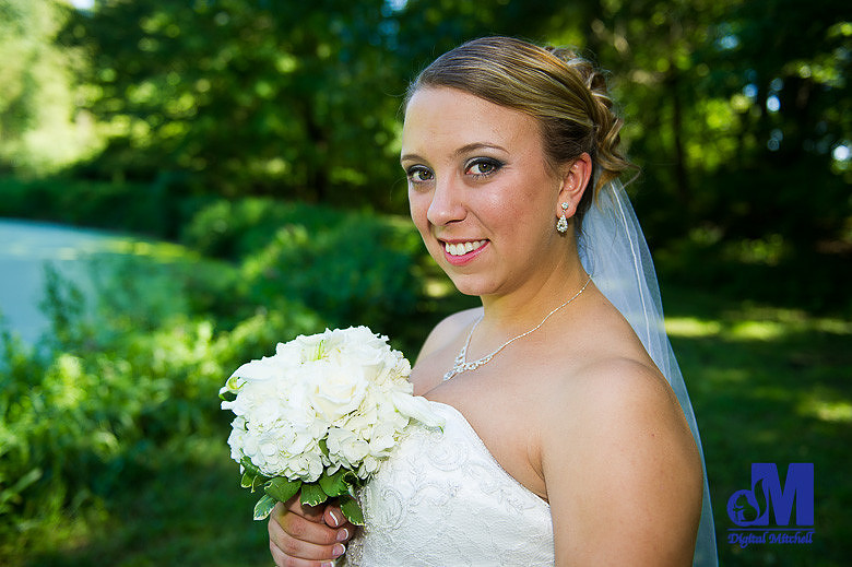 Photograph of bride with bouquet flowers