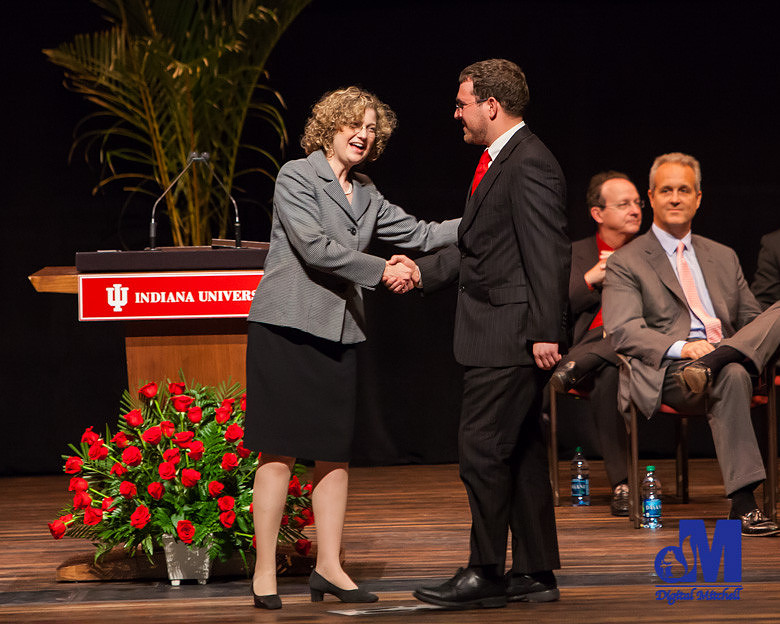 pictures of graduate walking across stage.