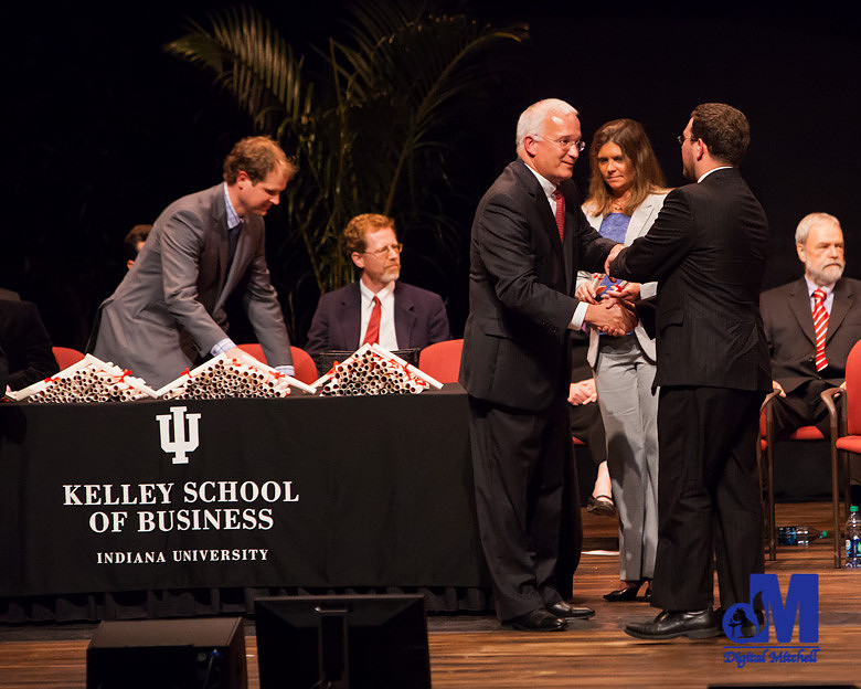photograph of graduate getting diploma
