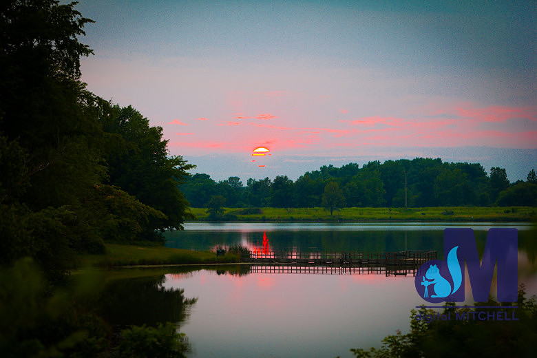 Photograph of setting sun over lake