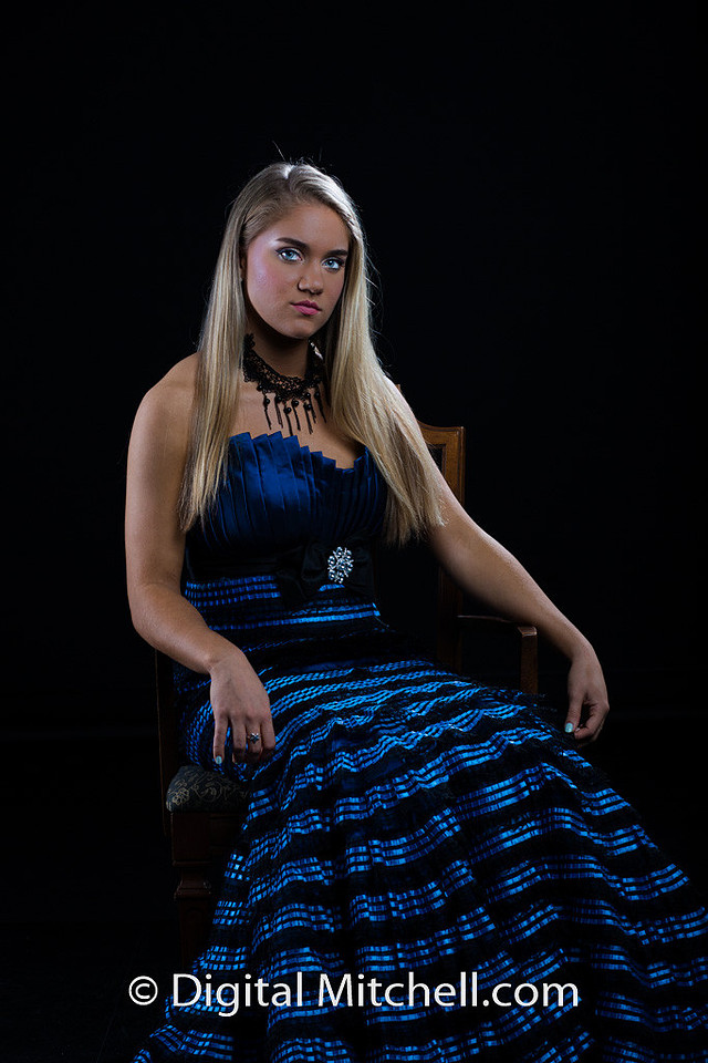 photograph of Erika in a blue dress sitting in a chair