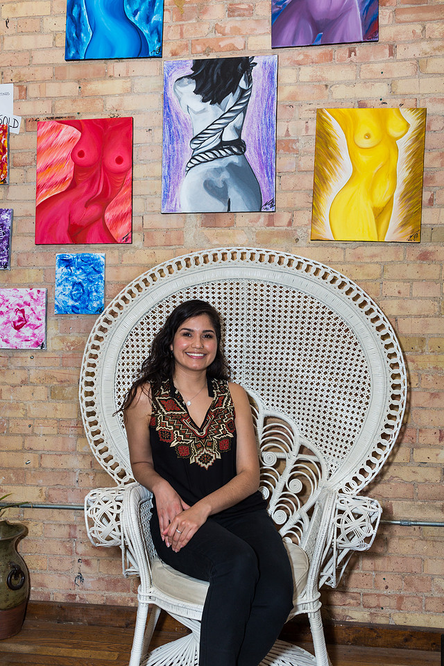 picture of artist with her nude artwork