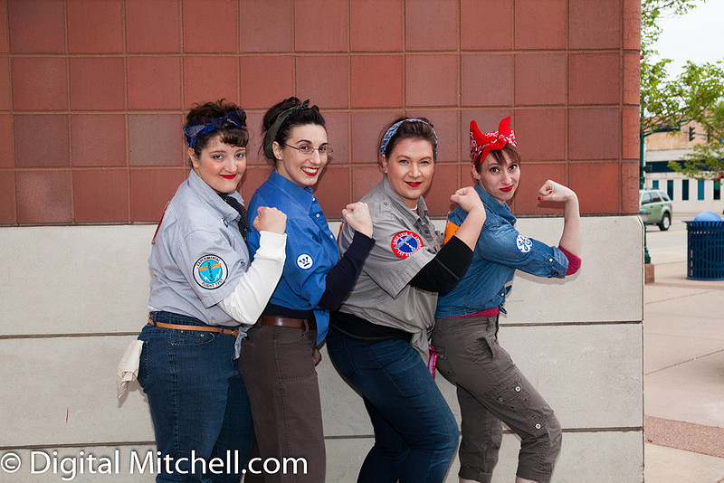 photograph of racers dressed up as Rosie the Riveters 