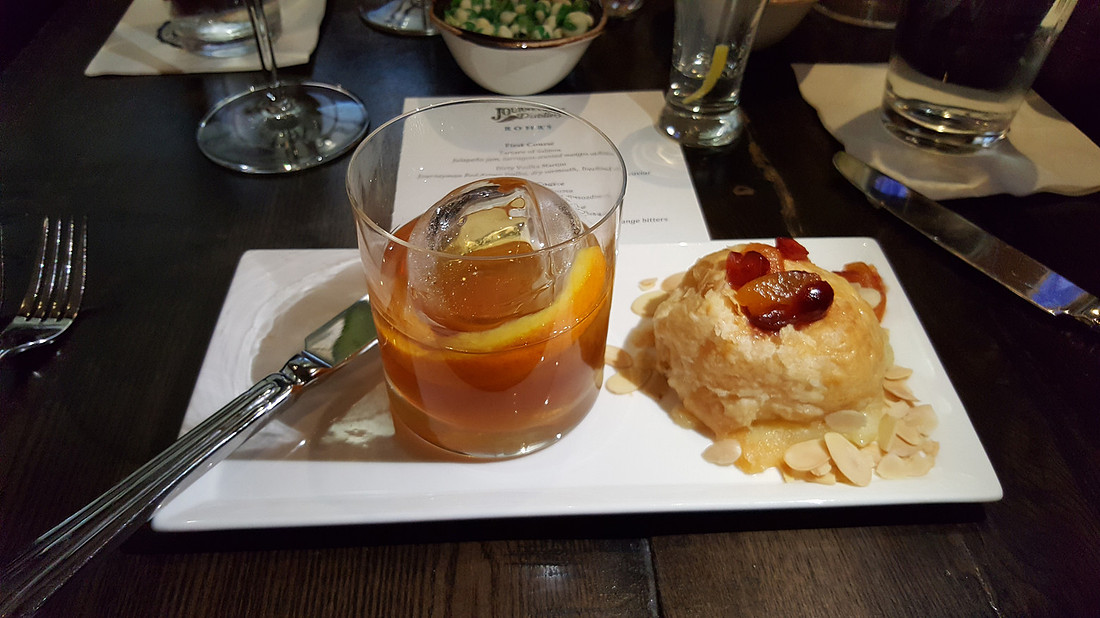 picture of backed brie and Manhattan on ice