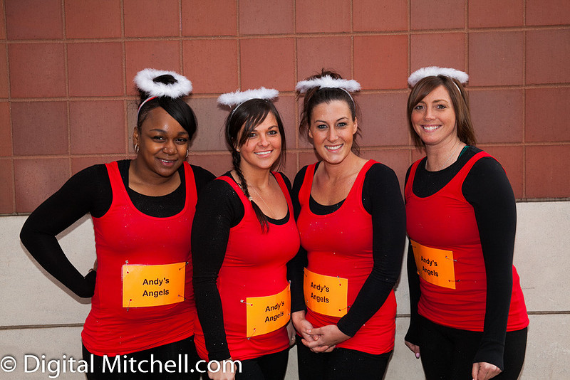 Photograph of racers dressed as angels in red and black