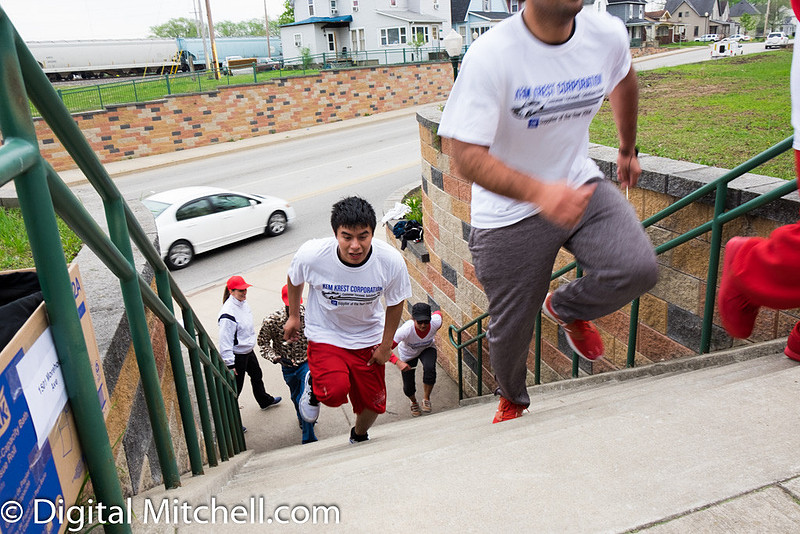 photograph of racers running up stairs