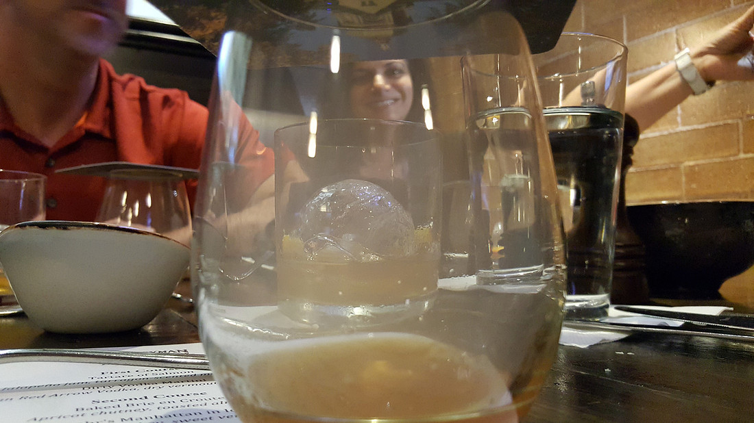 picture of girl shot through drinking glass