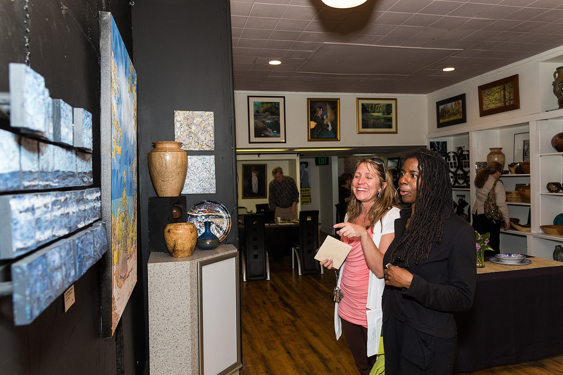 picture of guests looking at art