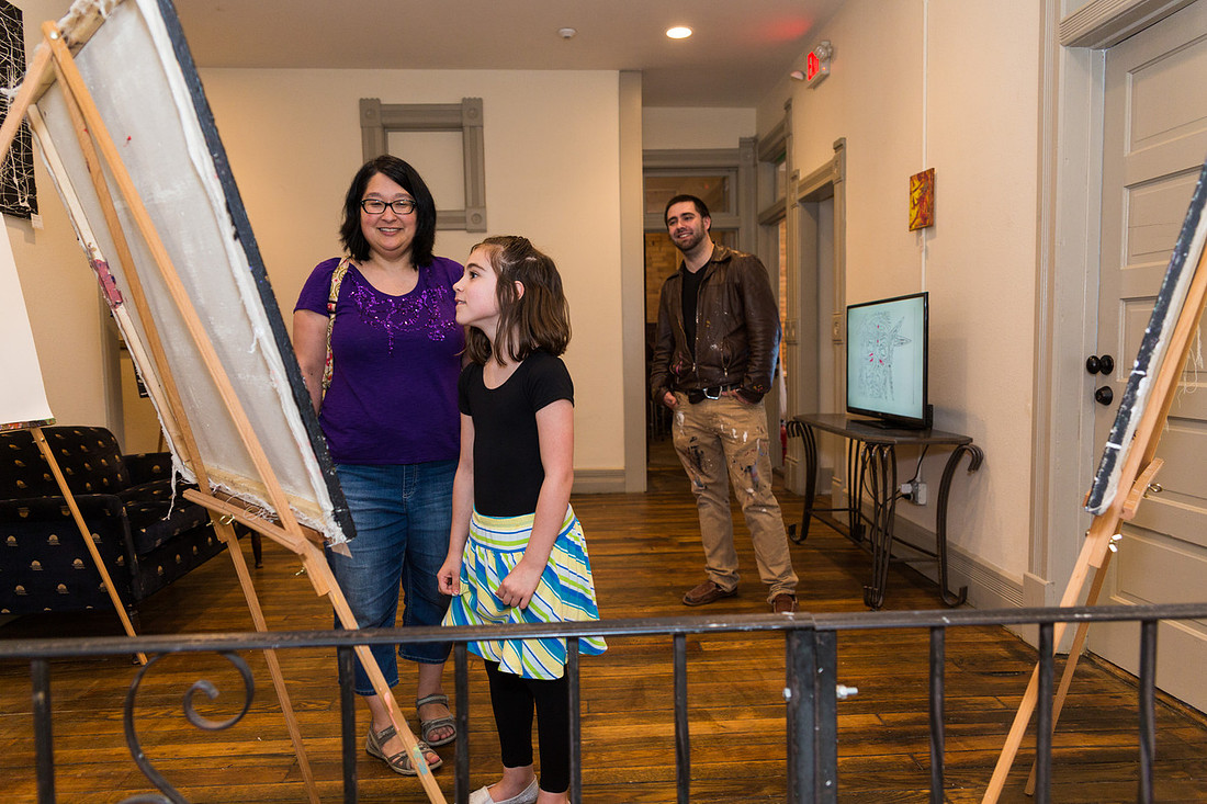 picture of child looking at art
