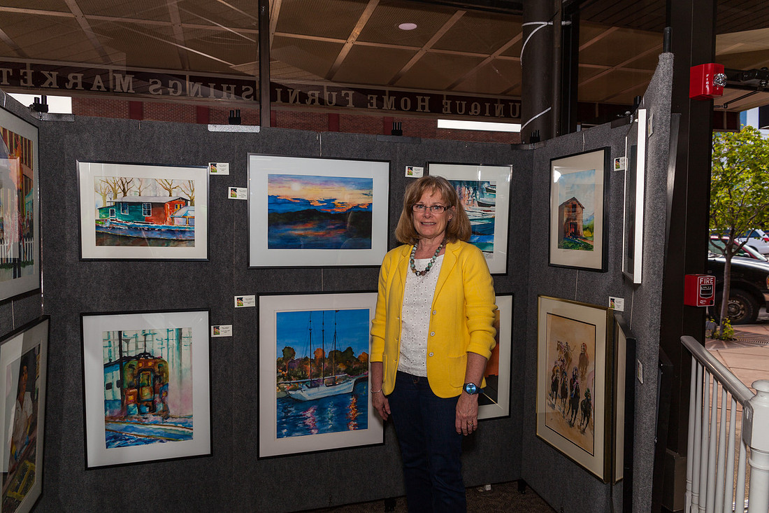 picture of artist with her paintings