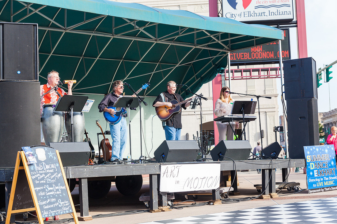 picture of musicians on a stage outside