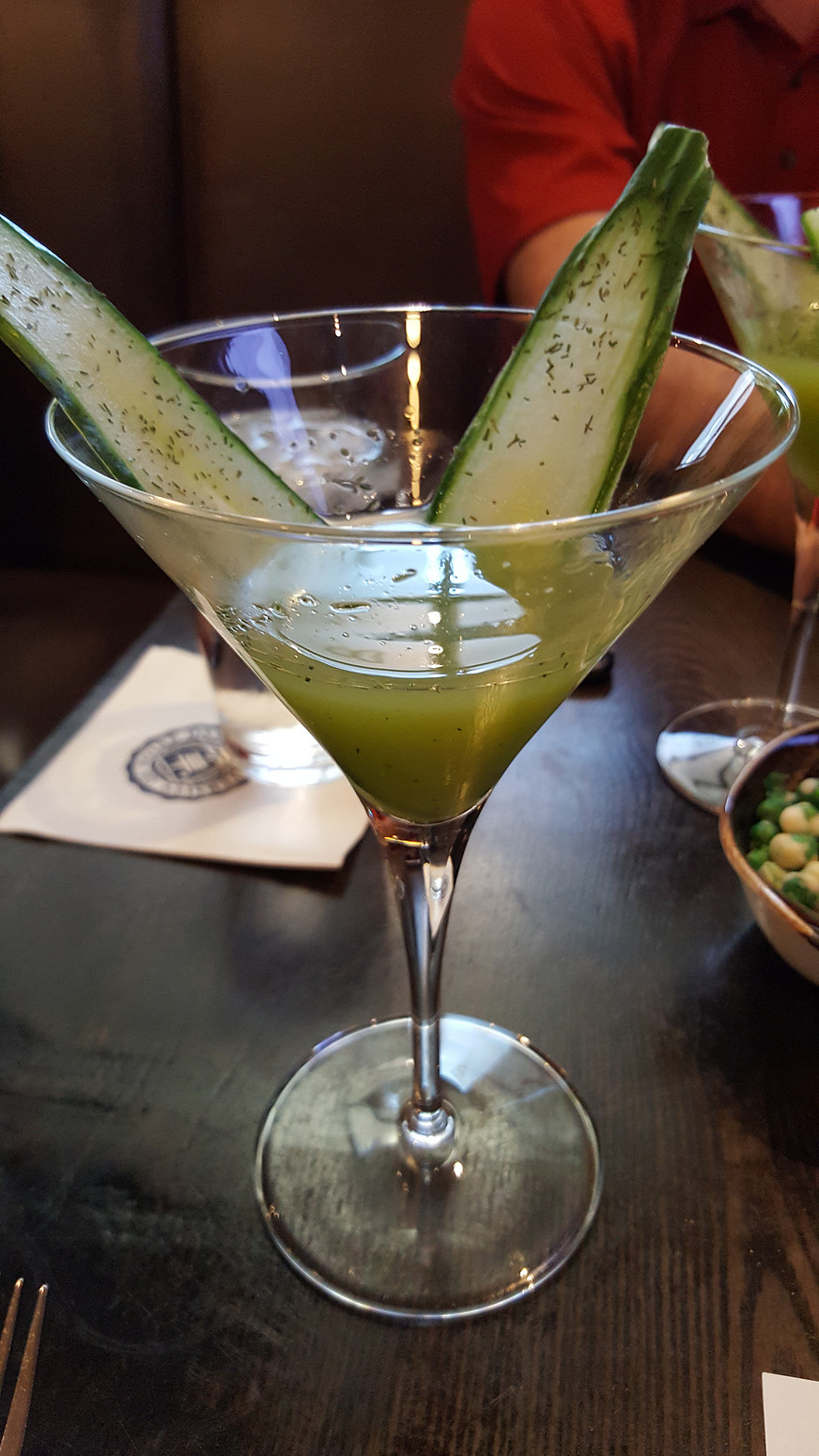 photograph of a gin based drink with dill seed