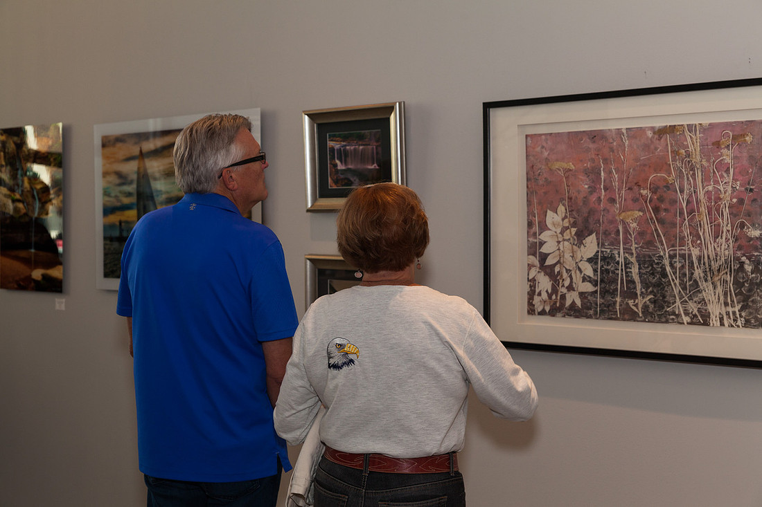 picture of people looking at art