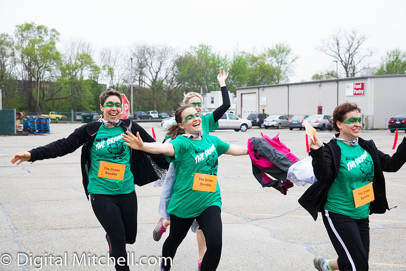photograph of a team crossing the finish line.