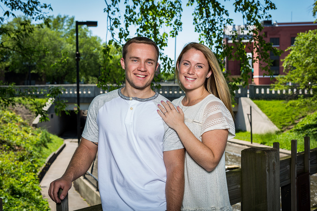 photograph of engaged couple overlooking the river