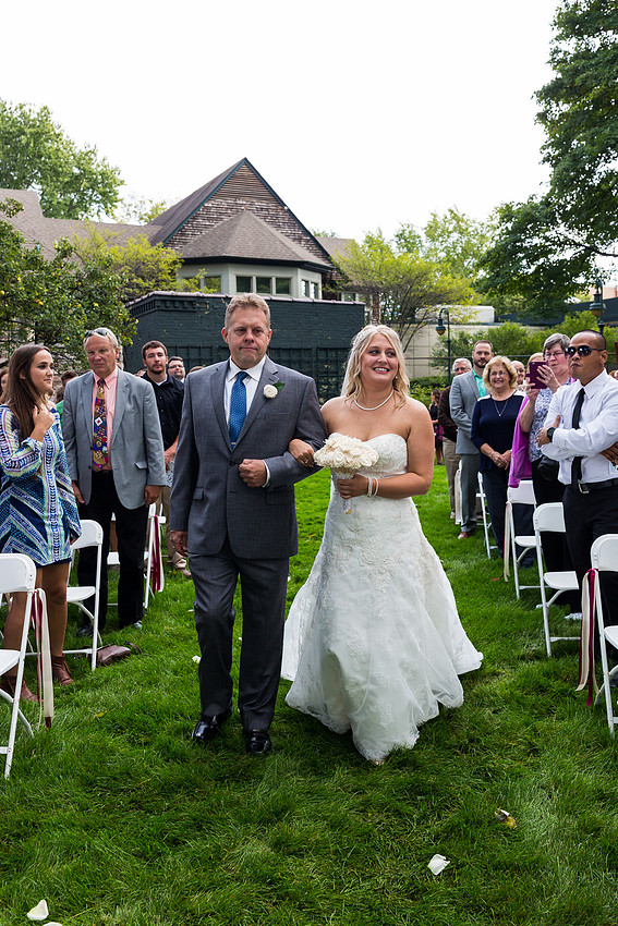 photograph of the bride being walked down the isle by her father