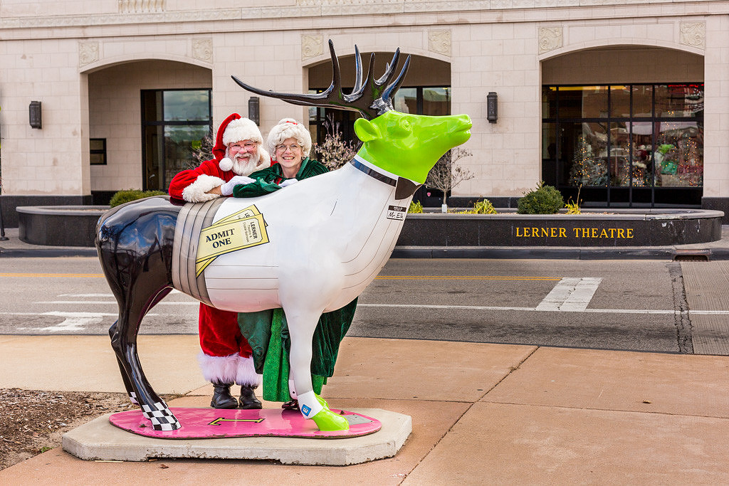 picture of an Elk with Santa and Mrs. Claus