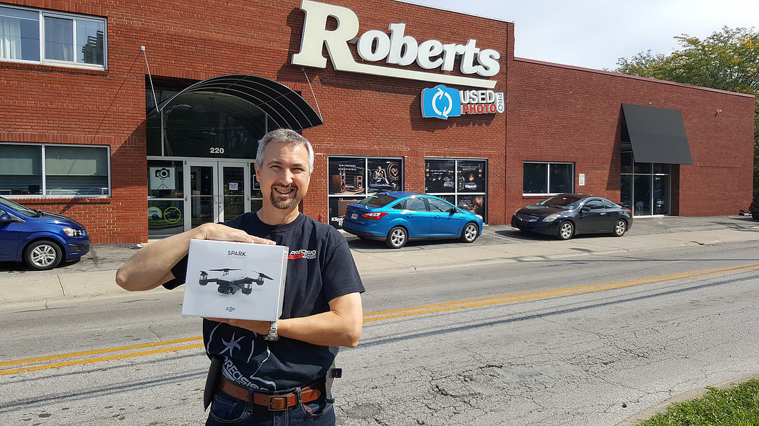 picture of photographer holding DJI Spark drone