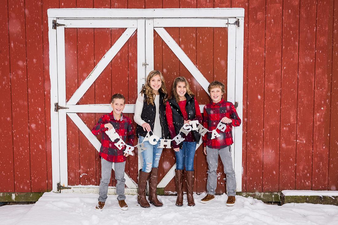 picture of kids in front of a red barn
