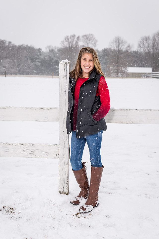 picture of a young girl in boots in the snow