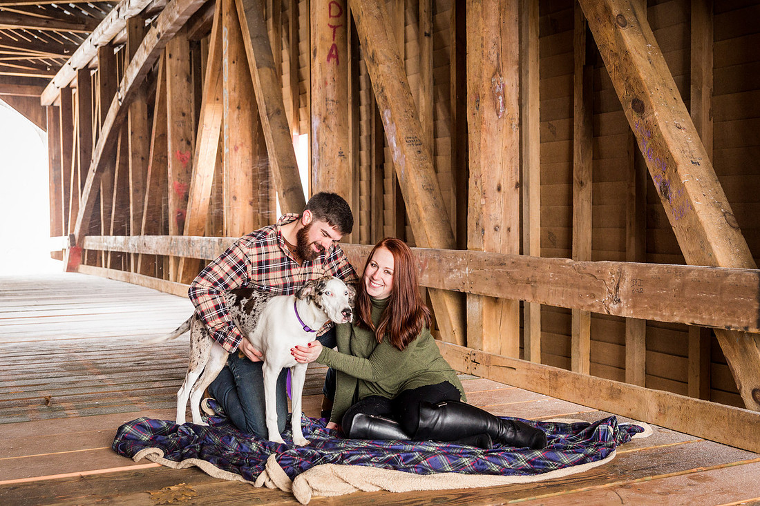 picture of dog with couple during engagement photo session