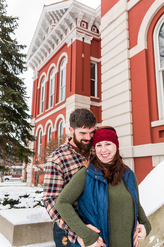 picture of a man embracing girl on engagement photo session