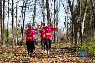 picture of girls running through the woods at Elkhart Amazing Race 2014