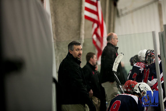 Michael coaching on the bench