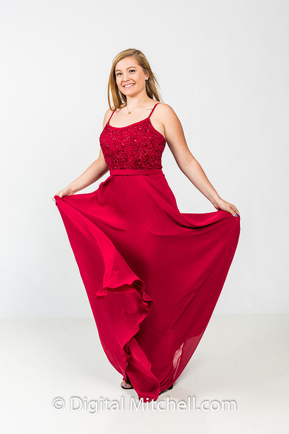 image of high school senior in red flowing dress