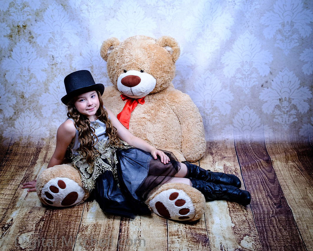 Photo with young girl and large stuffed bear