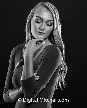 black and white photo of young high school senior with piercing eyes