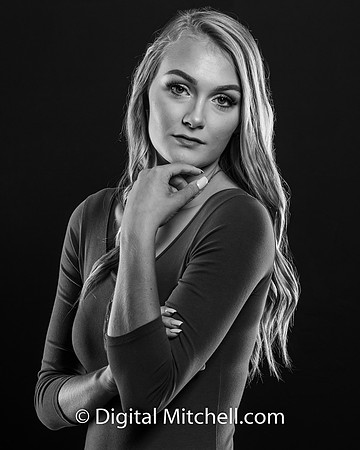 black and white photo of young high school senior with piercing eyes