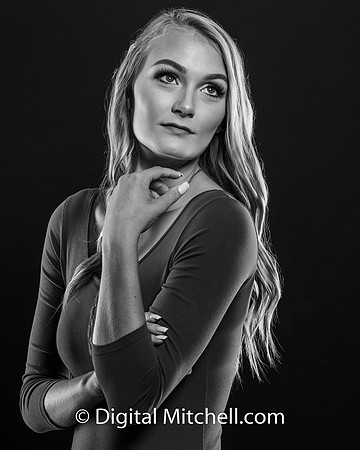 black and white photo of young high school senior with piercing eyes