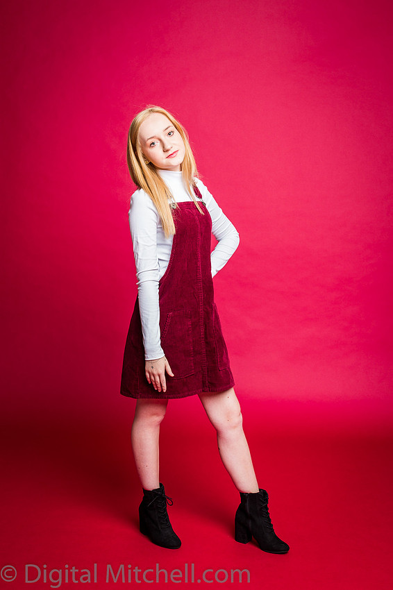 young model in red and white modeling on red paper