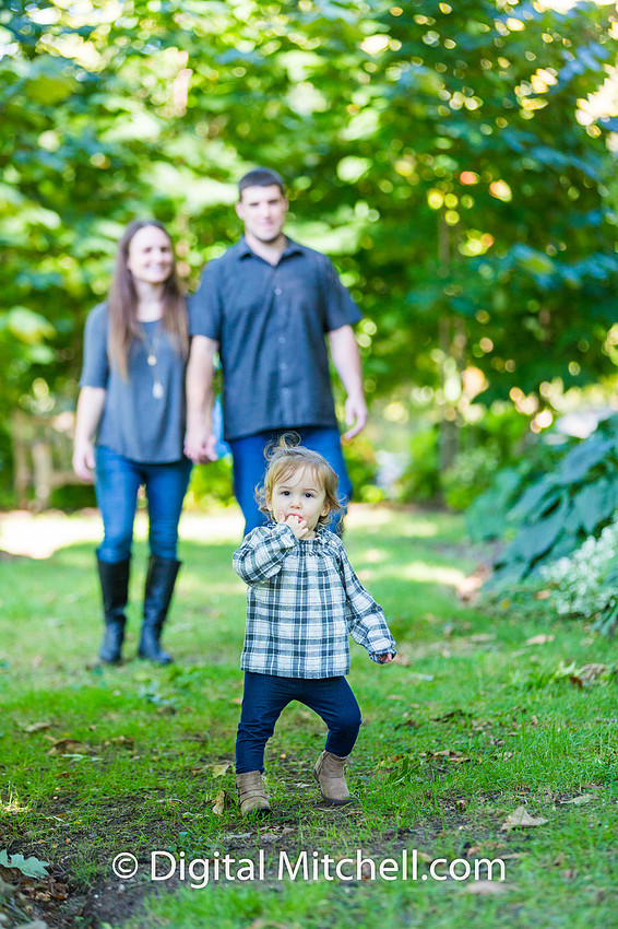 image of child with her family fall photo session