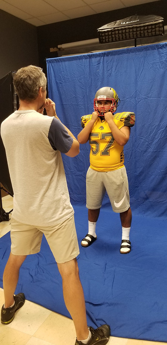 high school football player in the studio