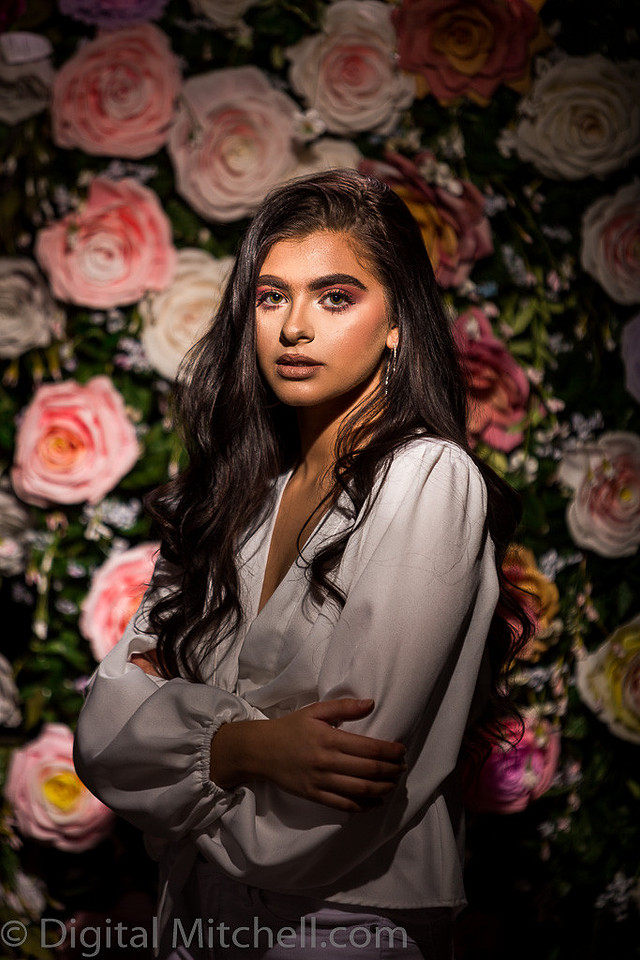 Picture of a young model in front of a Flower Wall